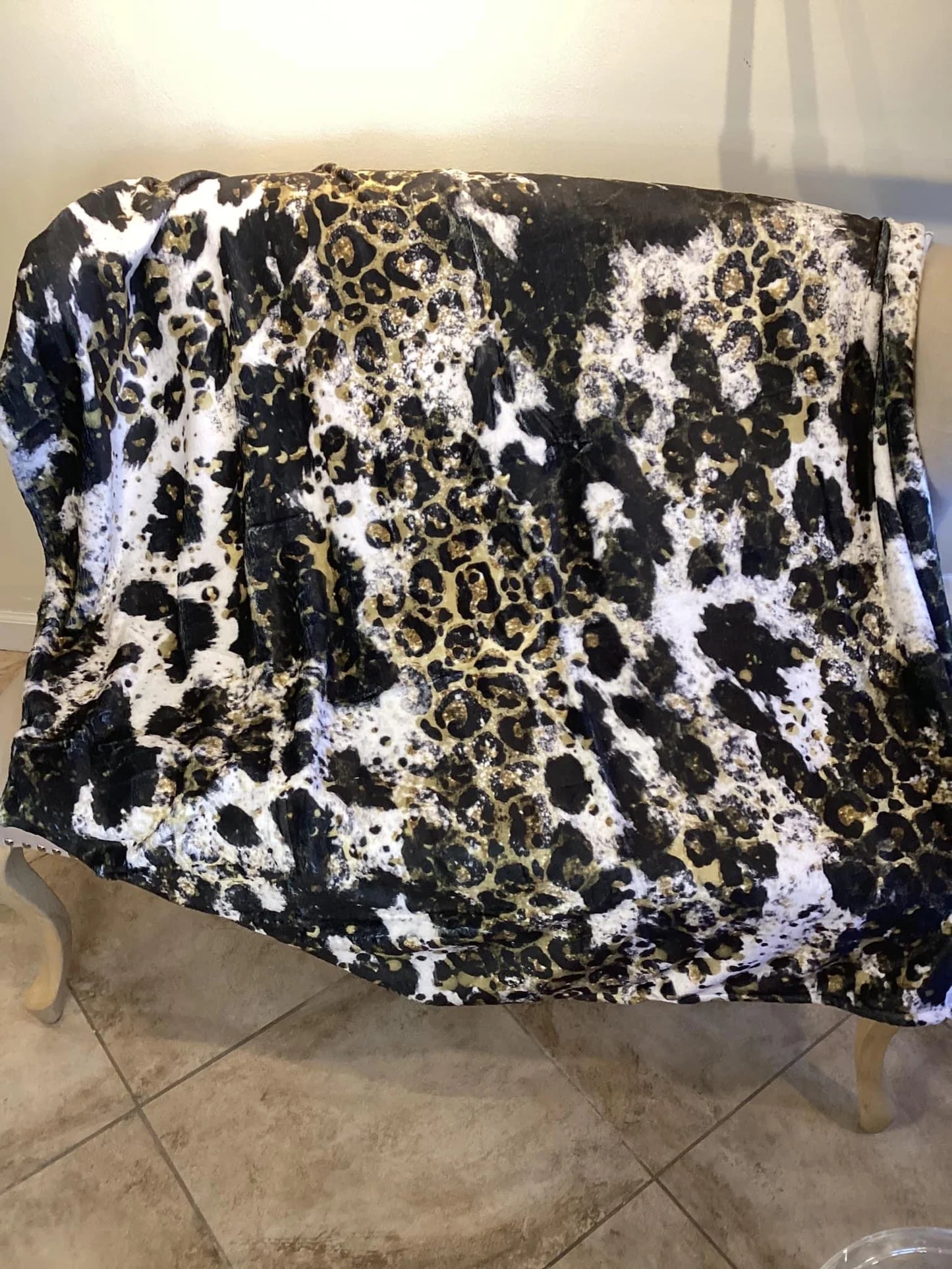 Black cow and leopard fleece blanket